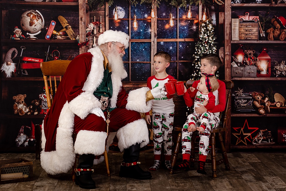 TWO CHILDREN WITH SANTA