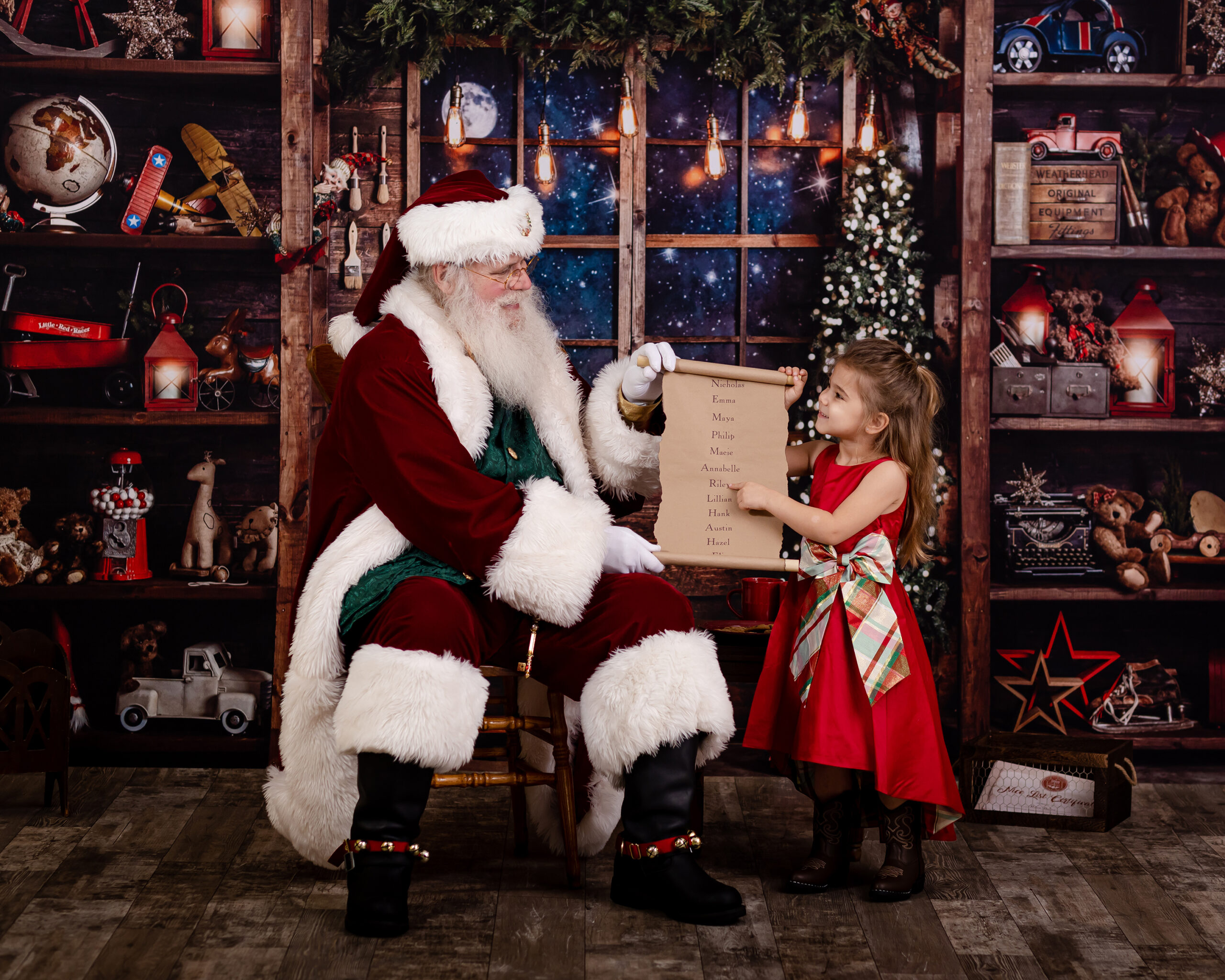 little girl pointing to santa's nice list