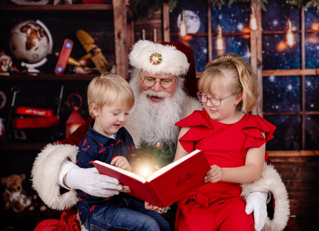 children reading a book with santa photos in tampa fl