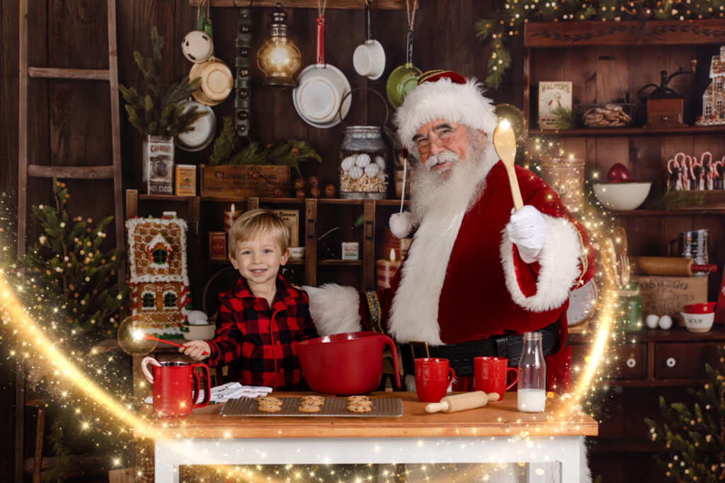 a young boy photographed with santa claus in his kitchen making cookies with santa and a lots of magic