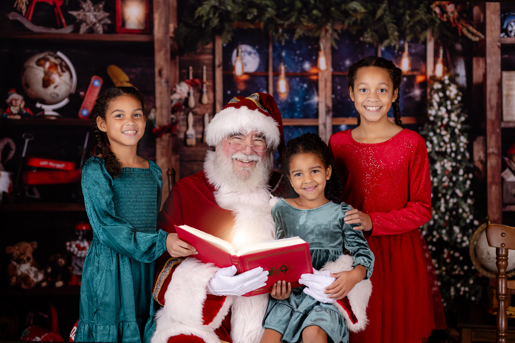 sisters smiling with santa claus in rolesville nc