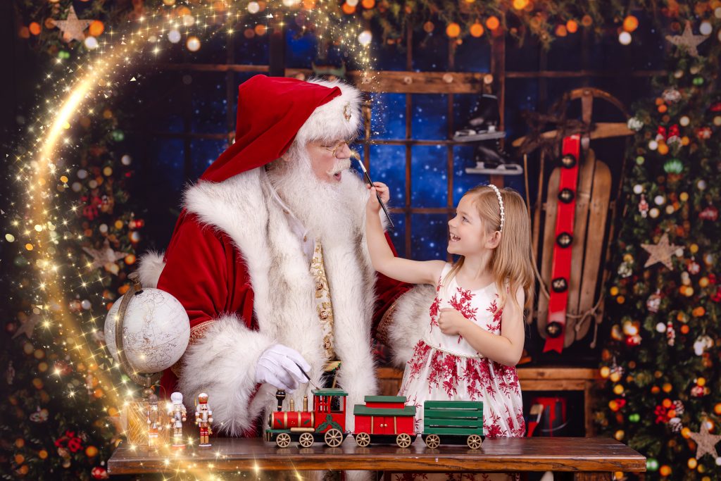 girl smiling with santa in palm harbor during her pictures with santa claus